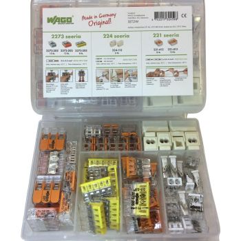 Läbipaistev plastkarp mõõtmetega 85x135x25 mm, milles on erinevat värvi ja kujuga elektrilised klemmid, mis on eraldatud sektsioonidesse; kaanel on teave klemmide kohta.